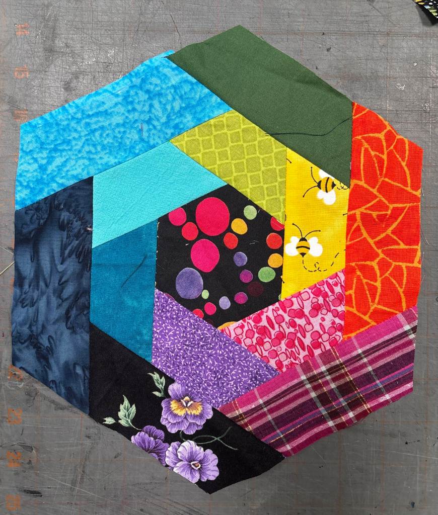 hexagon quilt block with a rainbow theme